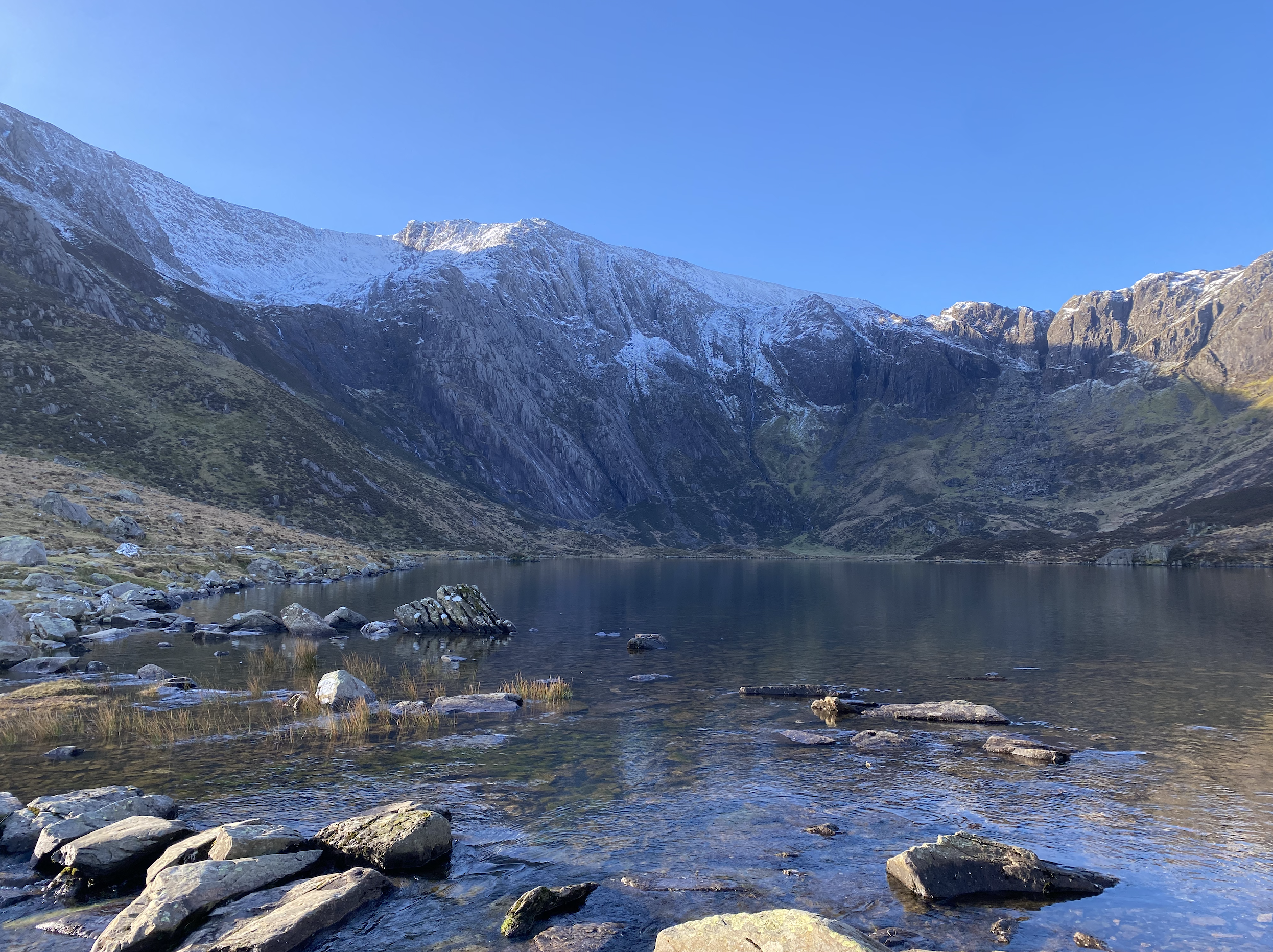 Llyn Idwal and snow-capped cliffs, Cwm Idwal