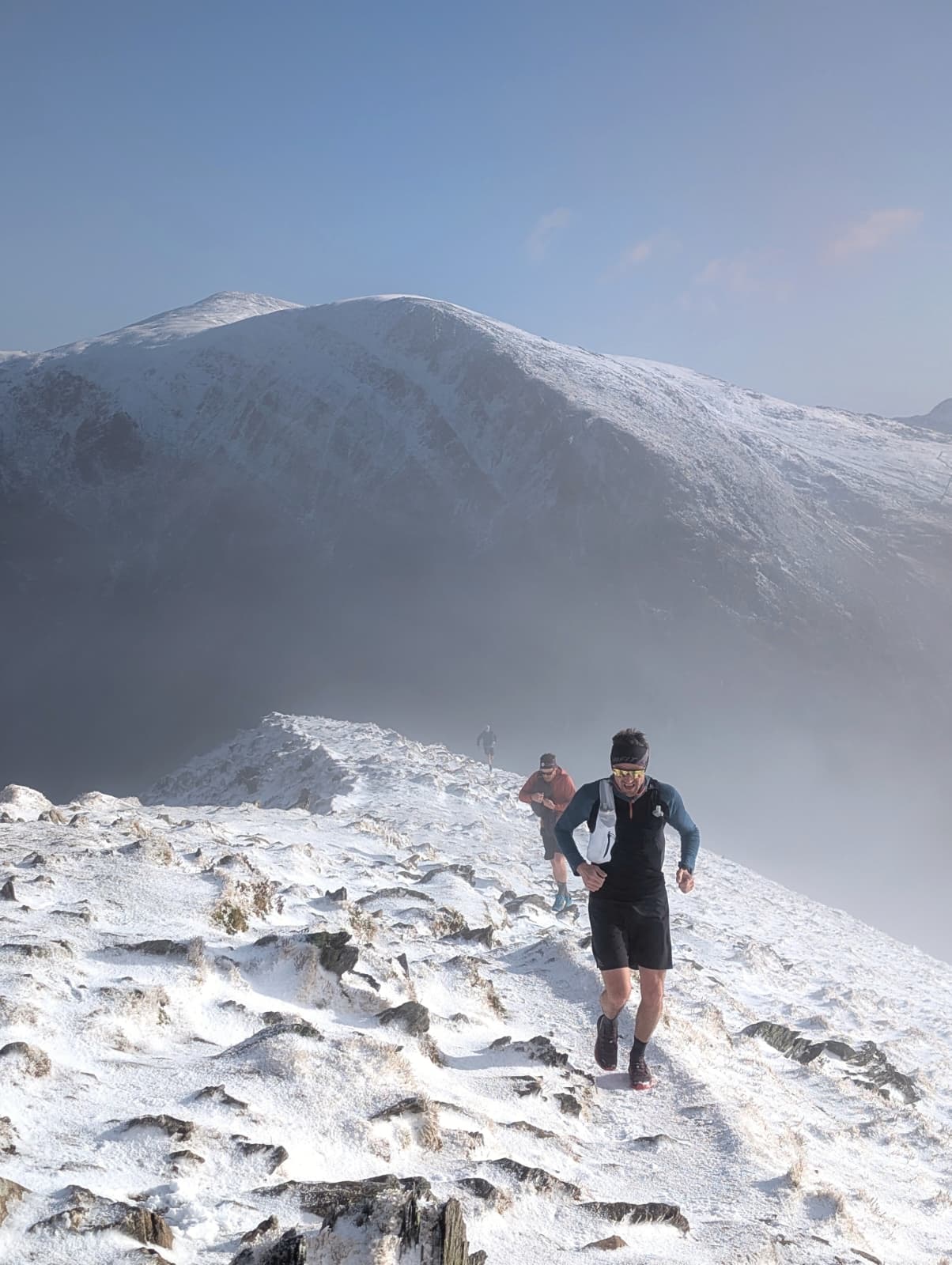 Climbing the snow ridge toward Y Garn